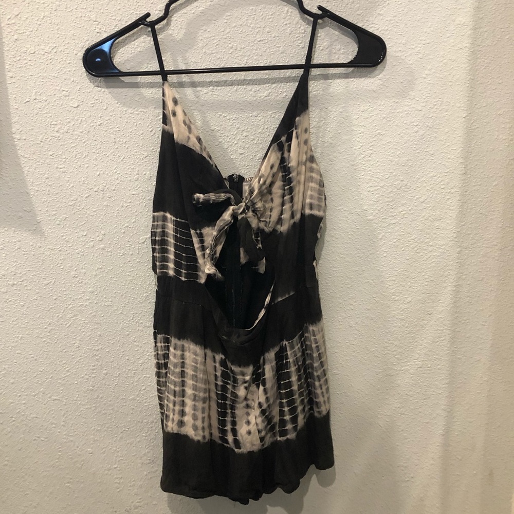 Front tie romper, with opening in front.